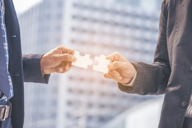 Implement puzzle improve communication solve synergy organize team building connection plan trust service strategy. stakeholders business trusted communicate teams hands holding jigsaw puzzle synergy Premium Photo